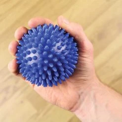 Fitness-Mad | Unisex Spiky Massage Ball -Ronhill Shop FMASSAGEL fitnessmad spikymassageball hand 952x952